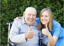old man and nurse giving thumbs up