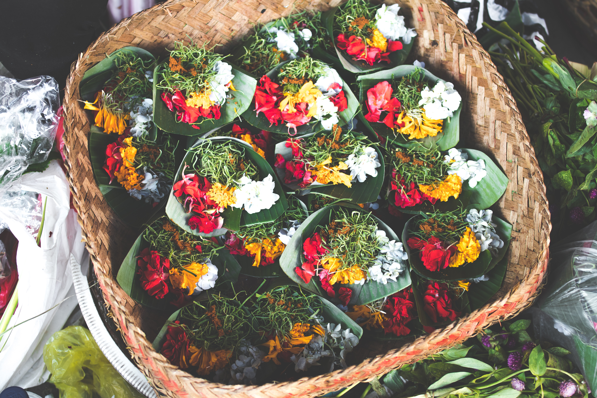 Basket of Balinese flowers wrapped in leaves. 