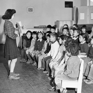 Students with teacher in Manzanar library.