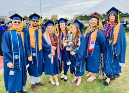 Group of students graduating and smiling