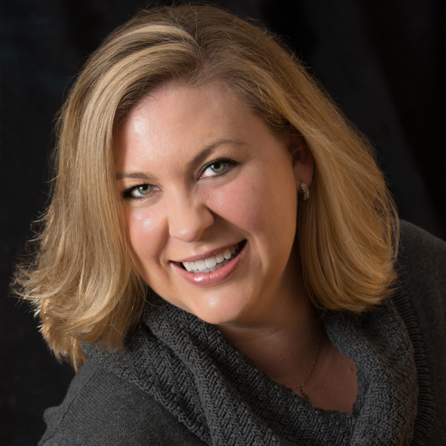 lady with short blonde hair smiling