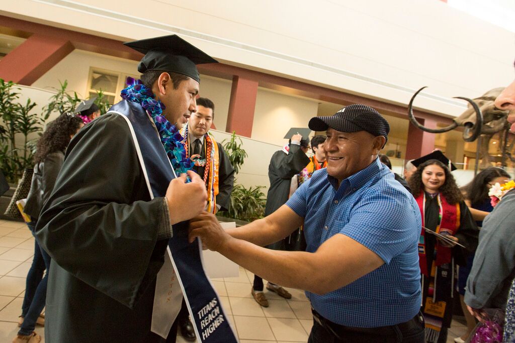 Father celebrates son's graduation